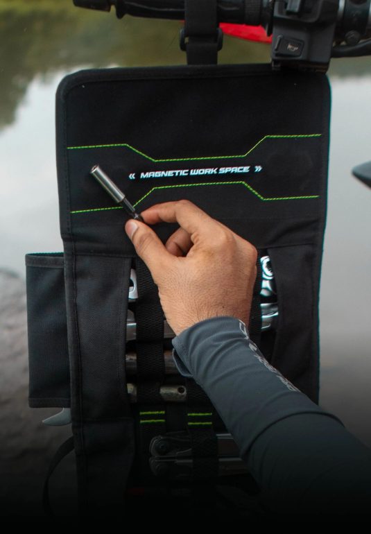 A black Rynox Navigator Tool Roll with multiple compartments and straps